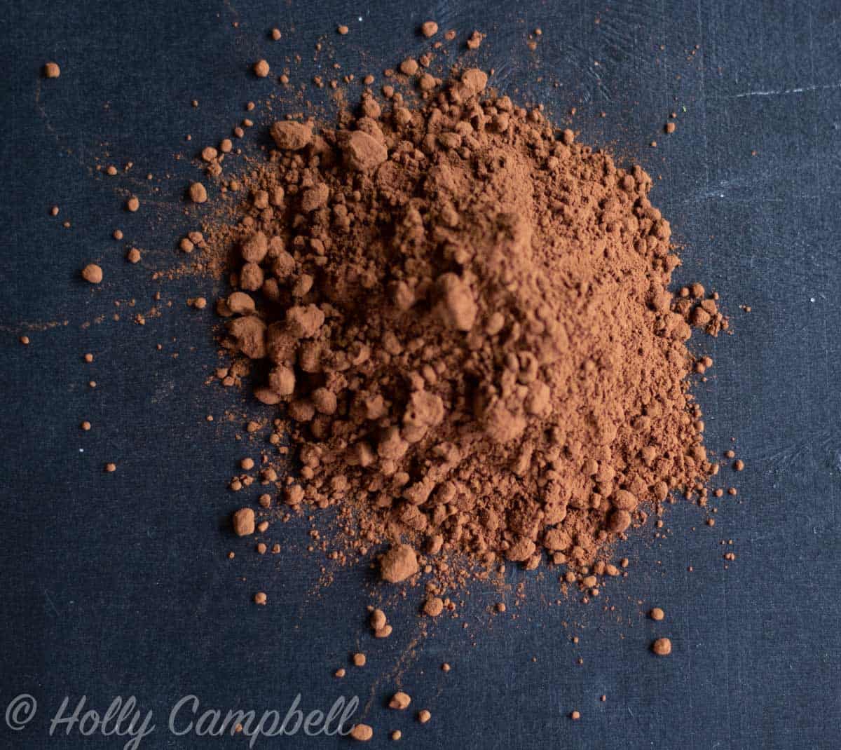 cocoa powder photographed on a dark background