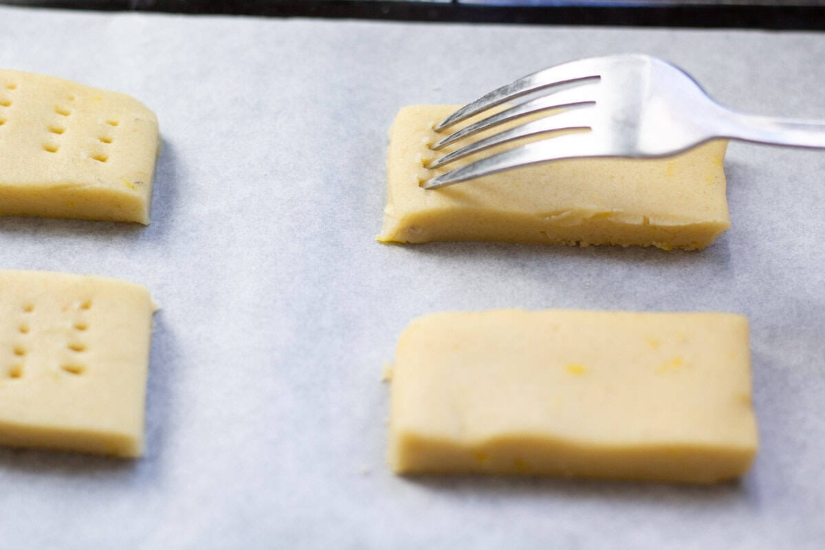 a fork pricking a cookie