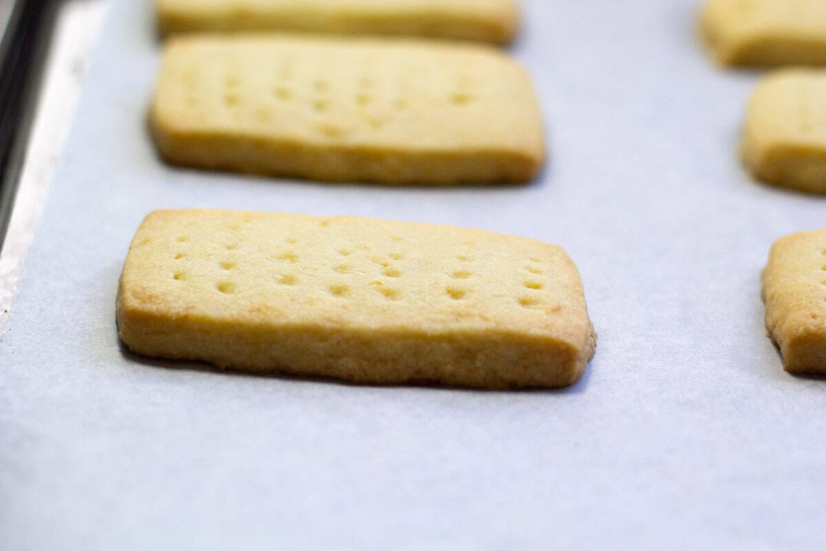 golden brown shortbread cookies on a baking sheet