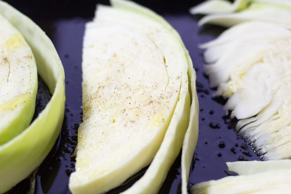 cabbage wedges with salt and pepper on top