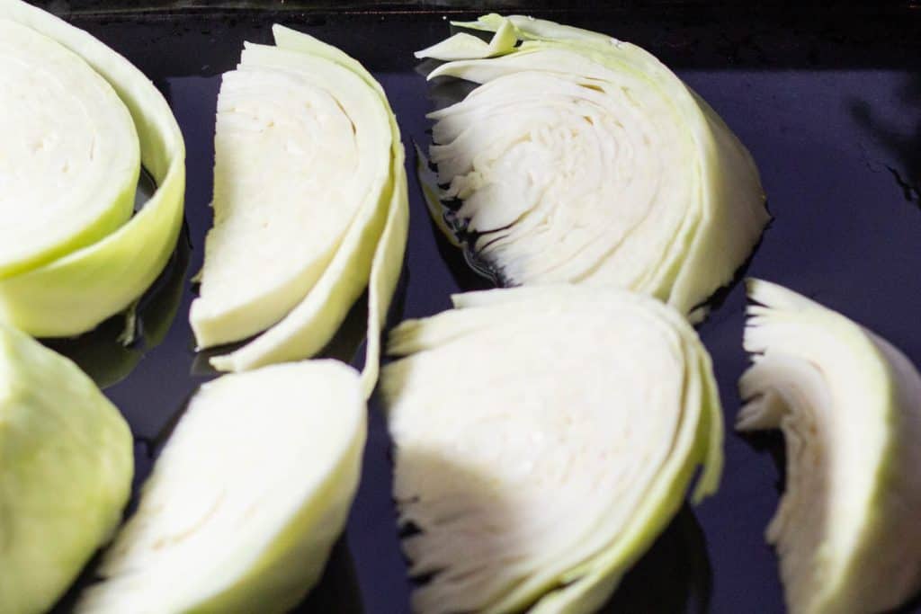 cabbage wedged on an oiled baking tray