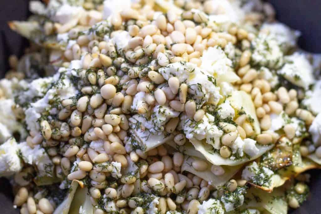 Roasted cabbage salad with dill dressing ingredient in a bowl, ready to be mixed