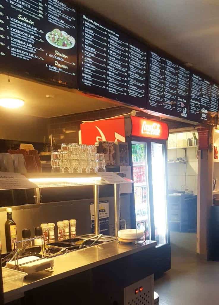 A Menu and sallad bar in a Swedsh Pizzeria