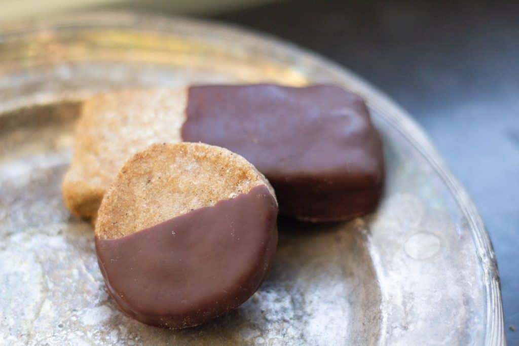 chocolate dipped gingerbread shotybread cookies on a silver tray