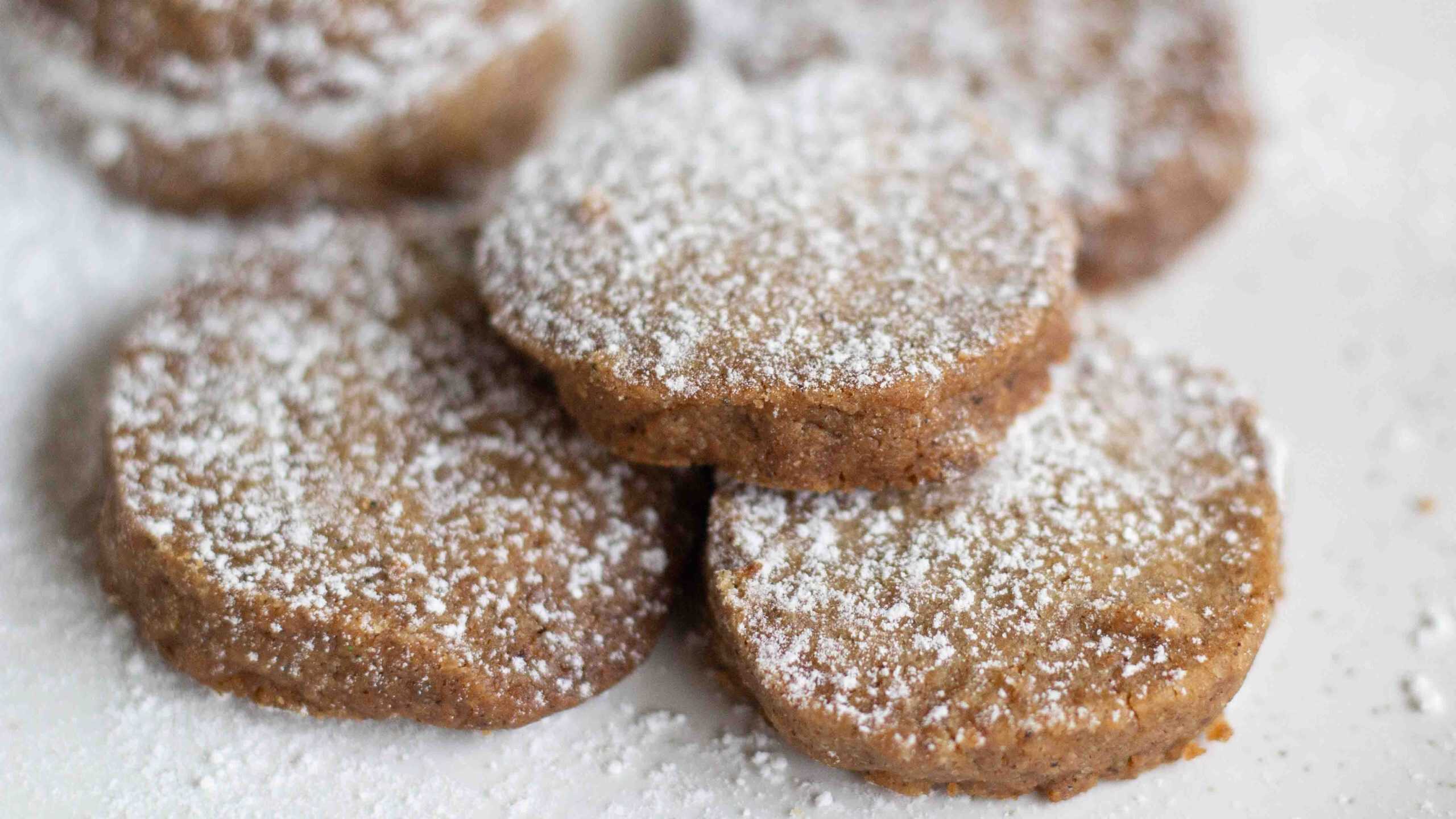 round gingerbread shortbread cookies dusted with powedered sugar