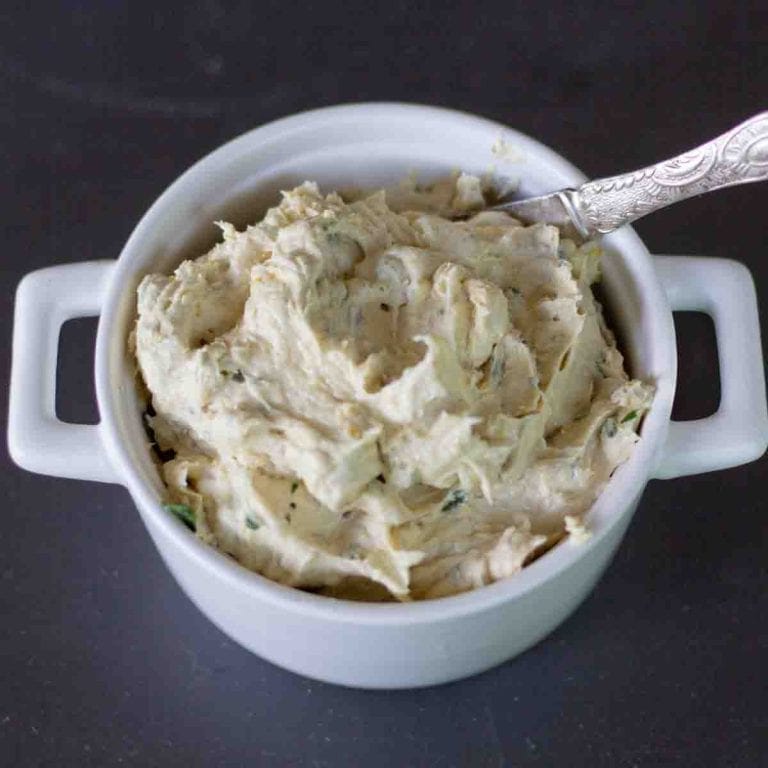 whipped Butter of the gods in a white serving dish with a silver knife